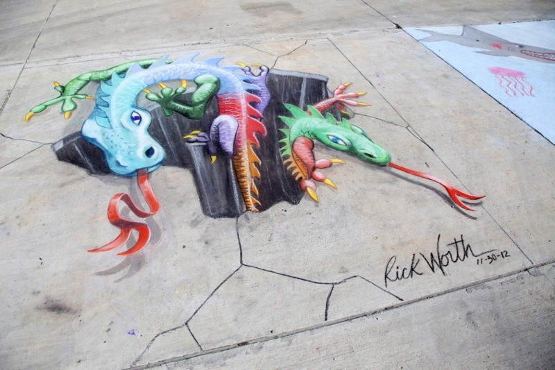 Brilliantly colored mythical creatures appear to emerge from a fissure in the earth in Key West artist Rick Worth's 2012 ChalkFest creation. Photo by Carol Tedesco